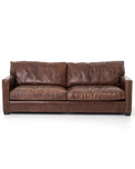 medium brown leather sofa with nailhead arms