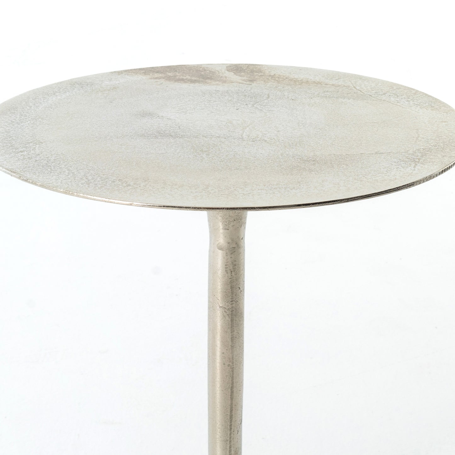 metal end table with raw nickel finish