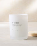 magnolia linen candle with wood lid notes scents of lemon lime cotton and jasmine
