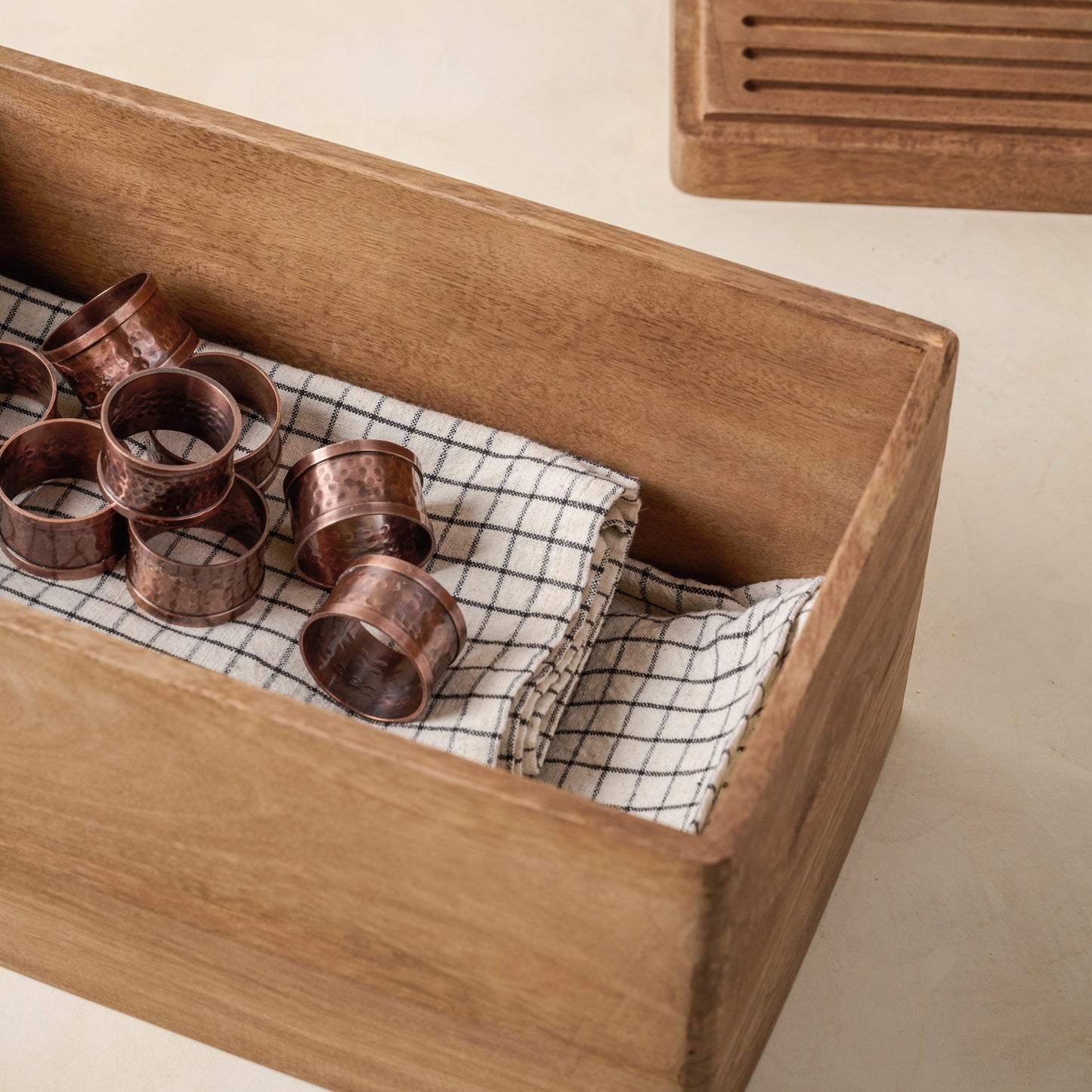 Magnolia Antiqued Wood Storage Box containing napkins
