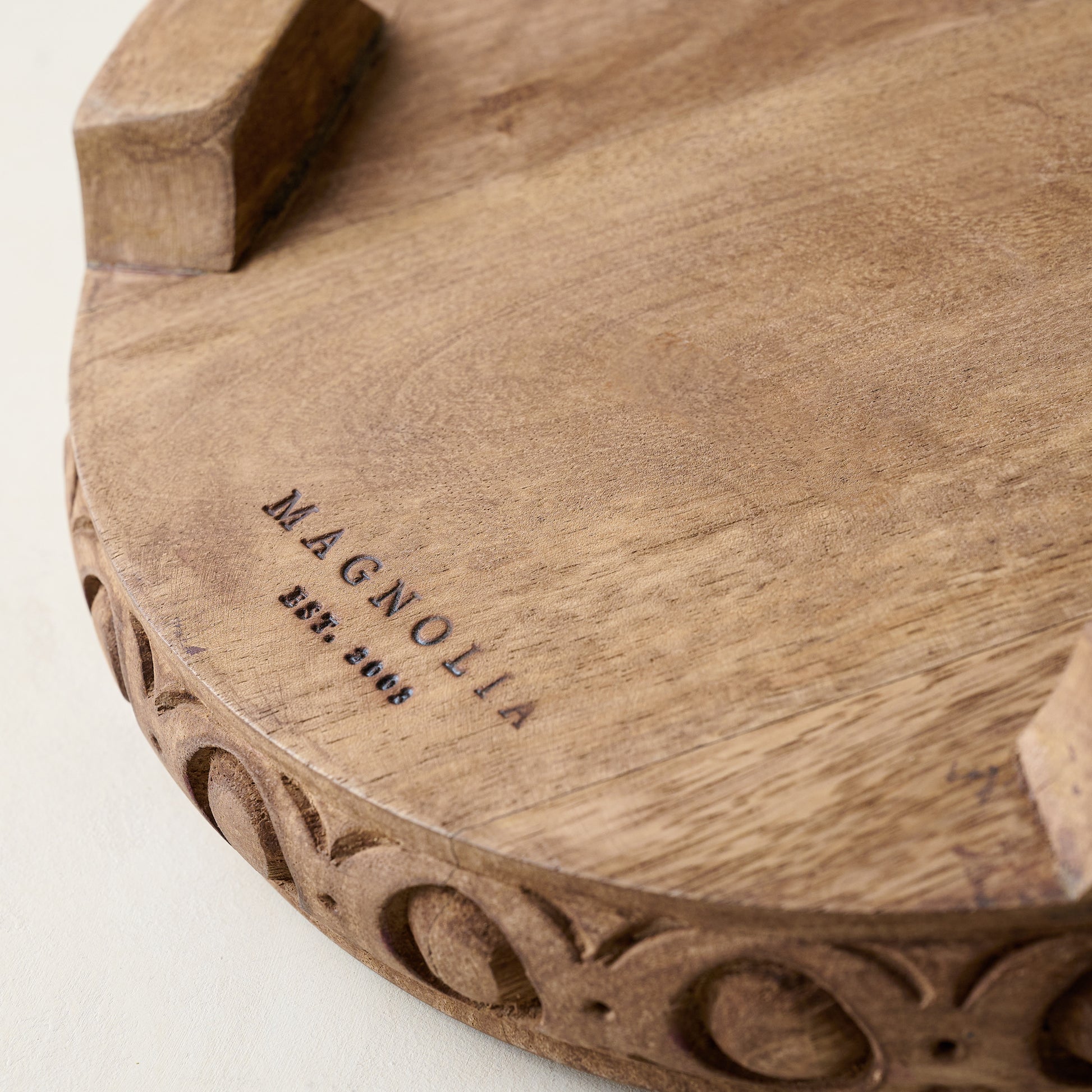 Antiqued Carved Wood Round Riser magnolia logo on the bottom