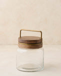 magnolia glass canister with wood and antique brass lid