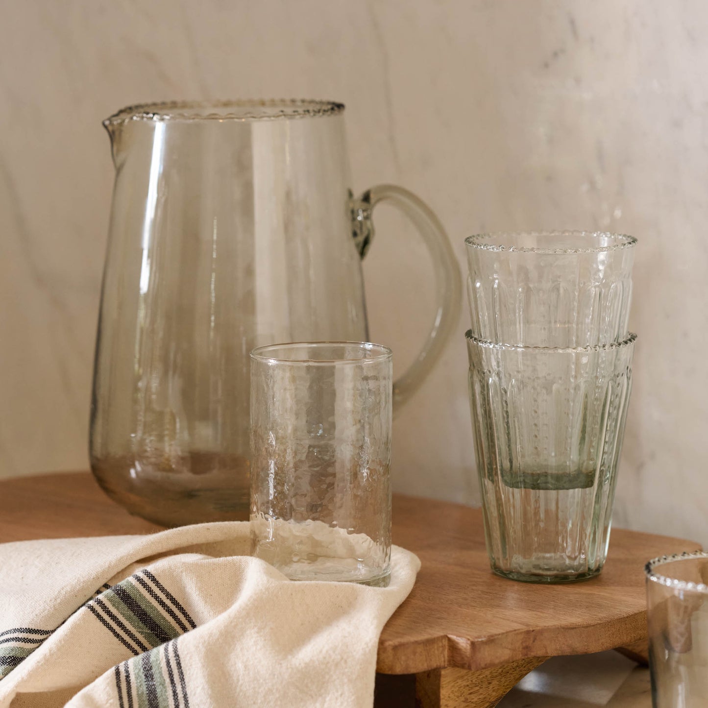Rustic Glass Tumbler on serving board with elizabeth bottle cut pitcher and tumblers