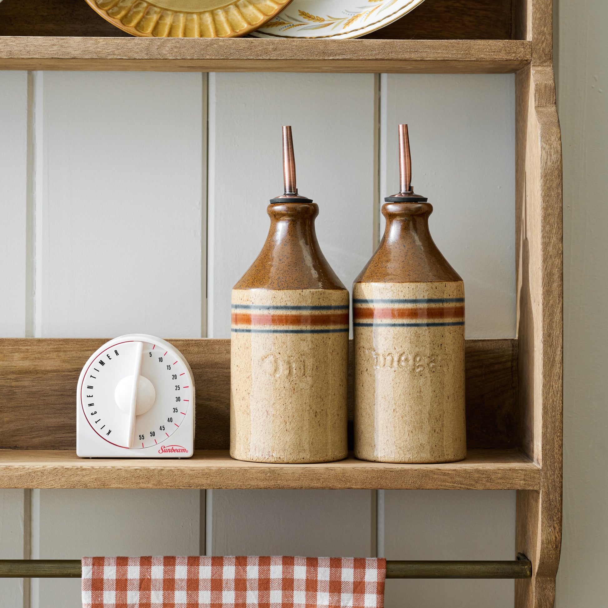 Hannon Wood and Brass Display Shelf with oil and vinegar bottles on shelf