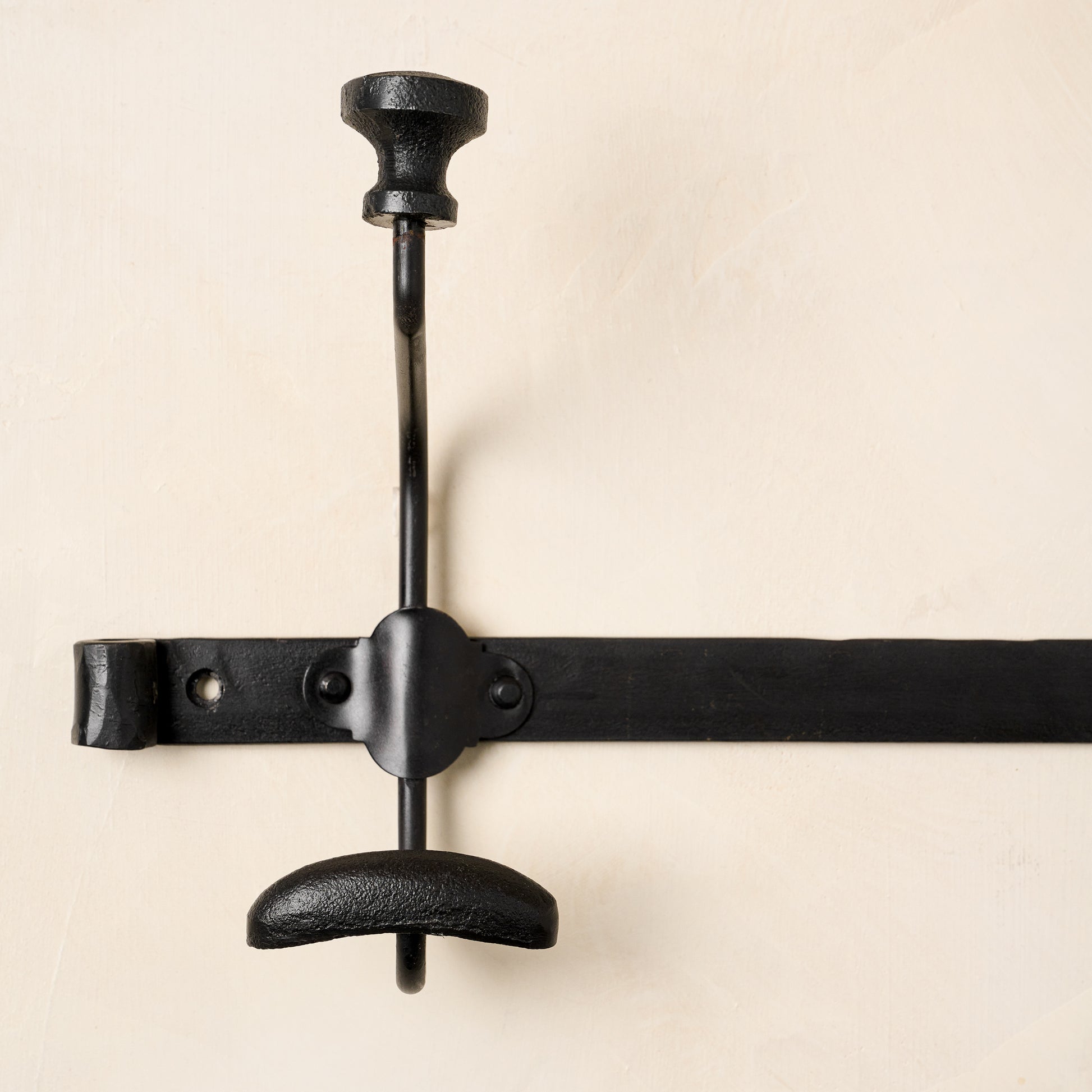 Close up of one of the duke metal wall hooks.