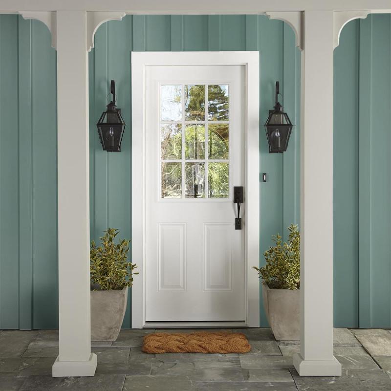 Dark aqua blue blended with a bit of ashy sage green exterior paint