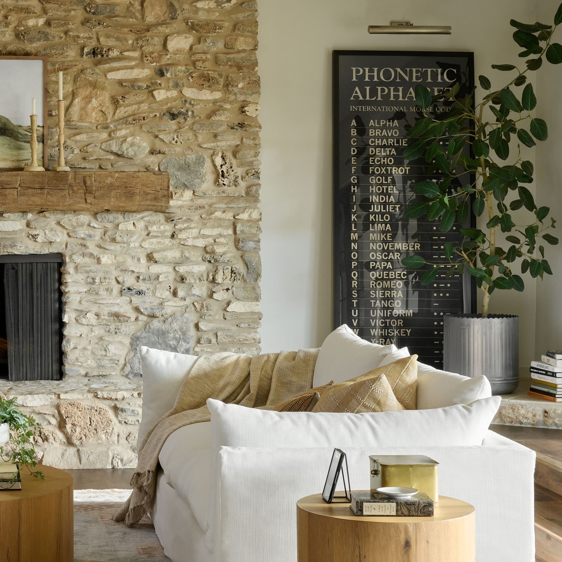overisized wall art piece called Phonetic Alphabet leaning again wall
