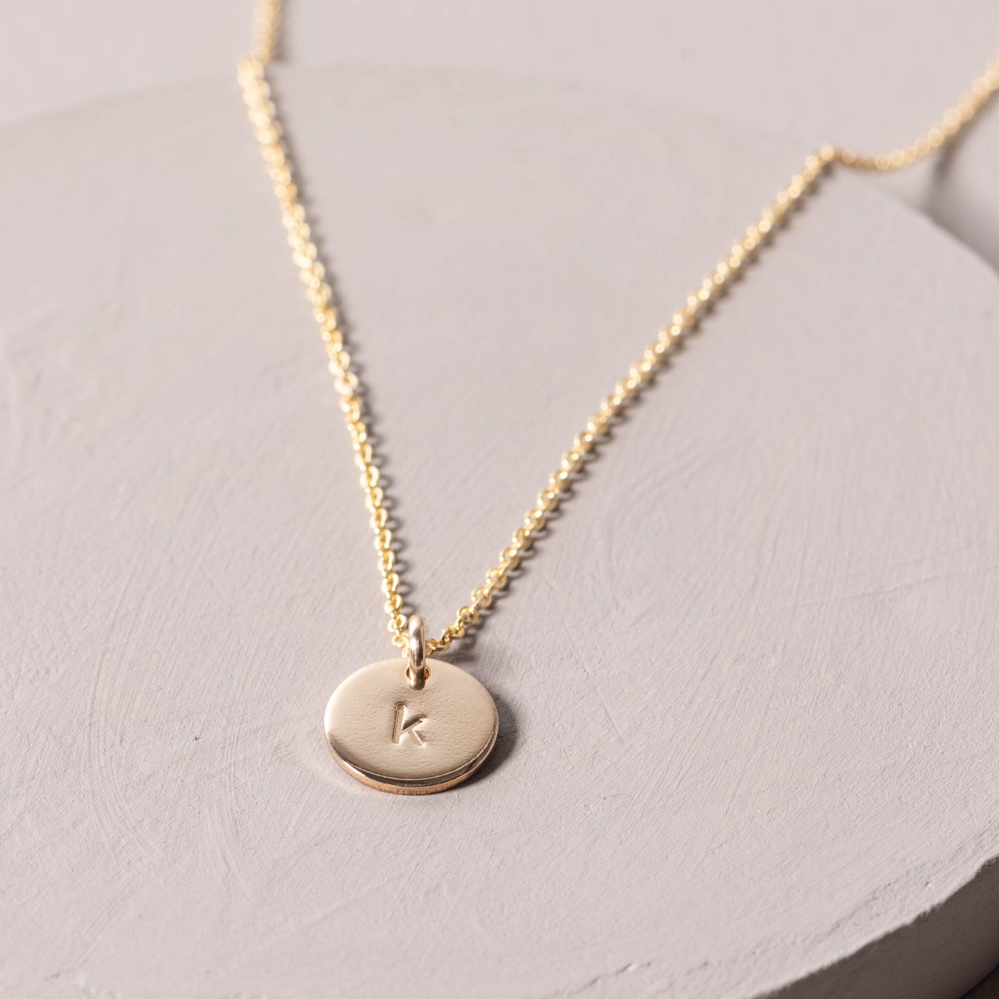 magnolia gold initial disc necklace