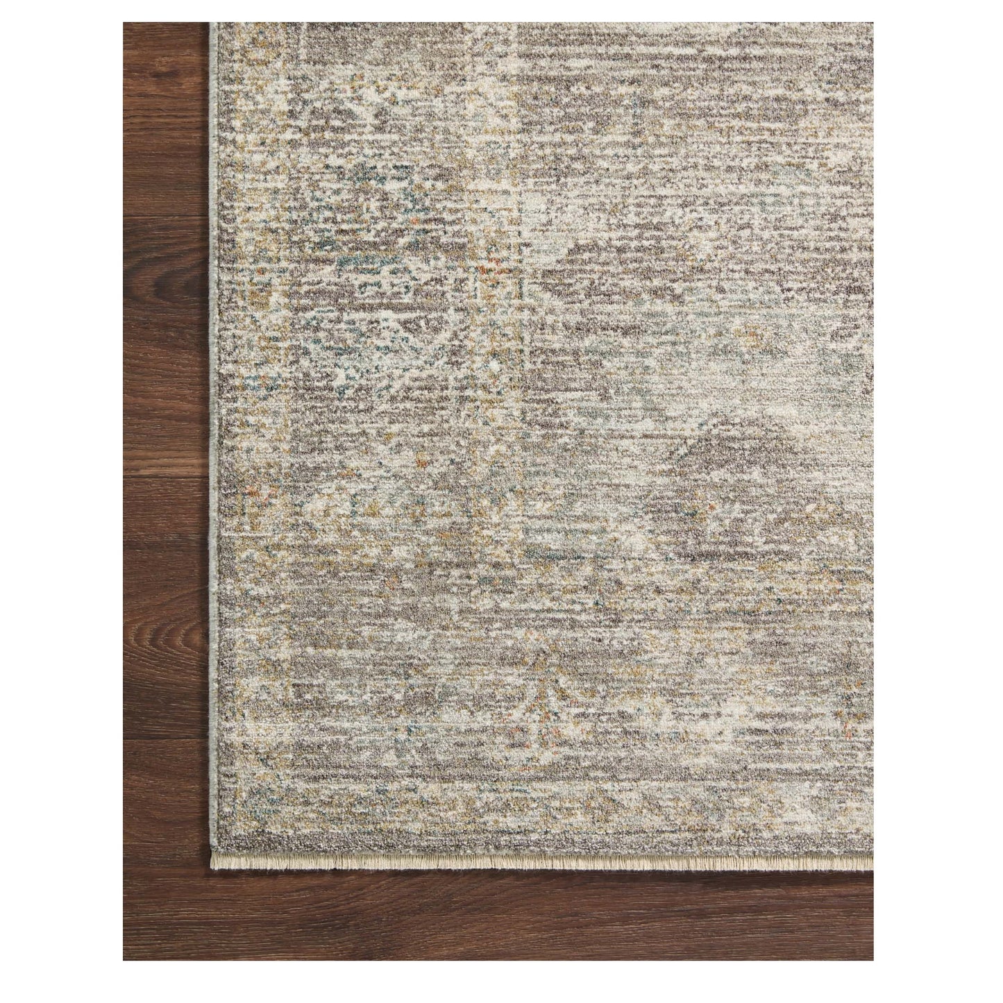 Millie Stone Natural Rug corner on wood floor
