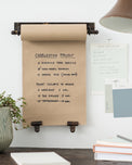 hanging black metal bracket and paper scroll