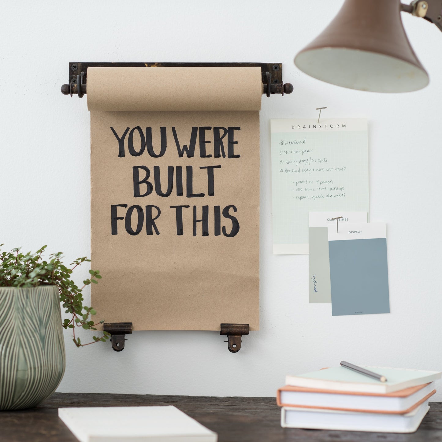 hanging black metal bracket and paper scroll