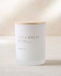 magnolia stay a while candle with wood lid notes scents of green tea and lavender