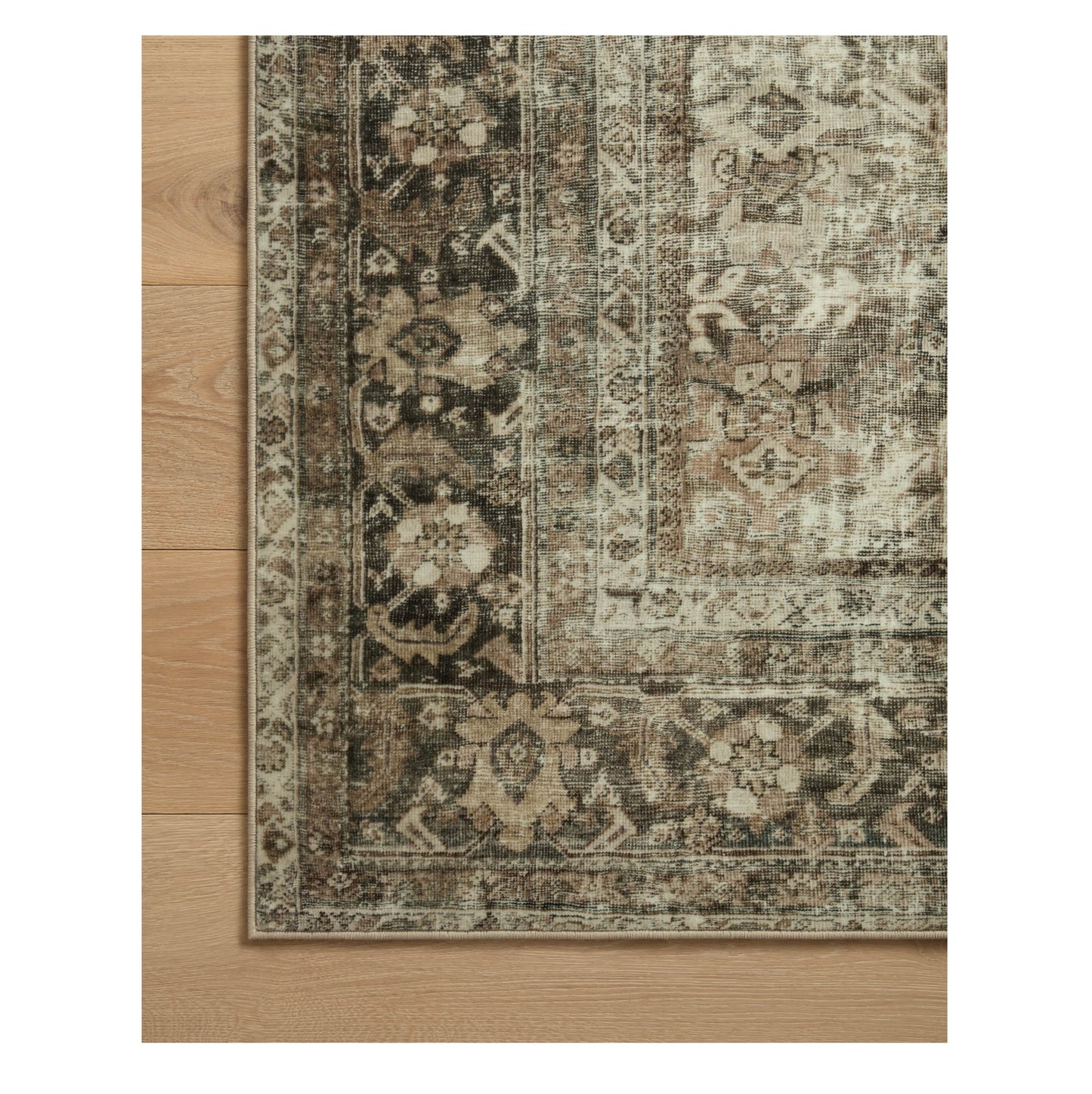 Sinclair Pebble Taupe Rug corner on wood floor