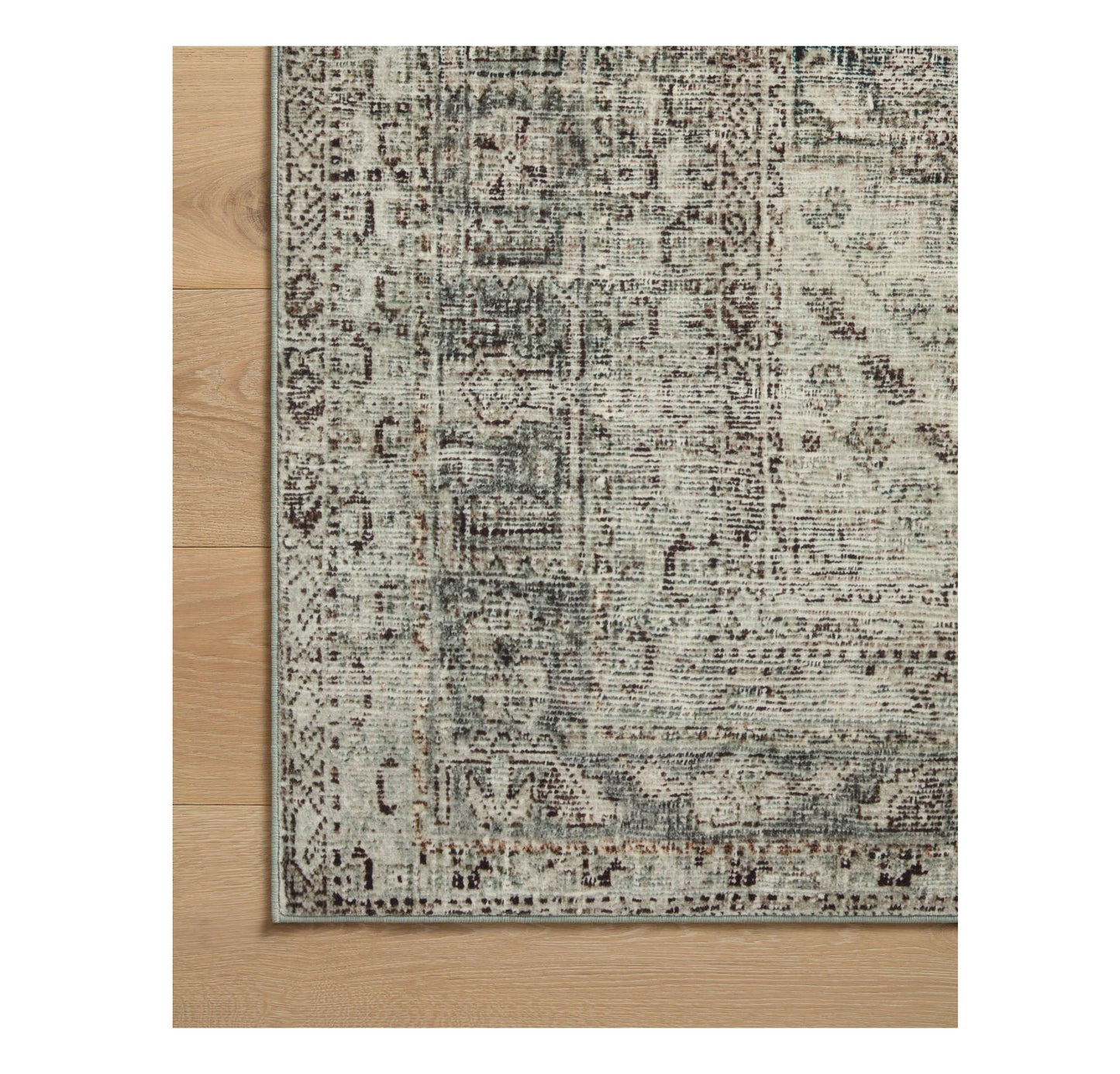 Sinclair Natural Sage Rug corner on wood floor