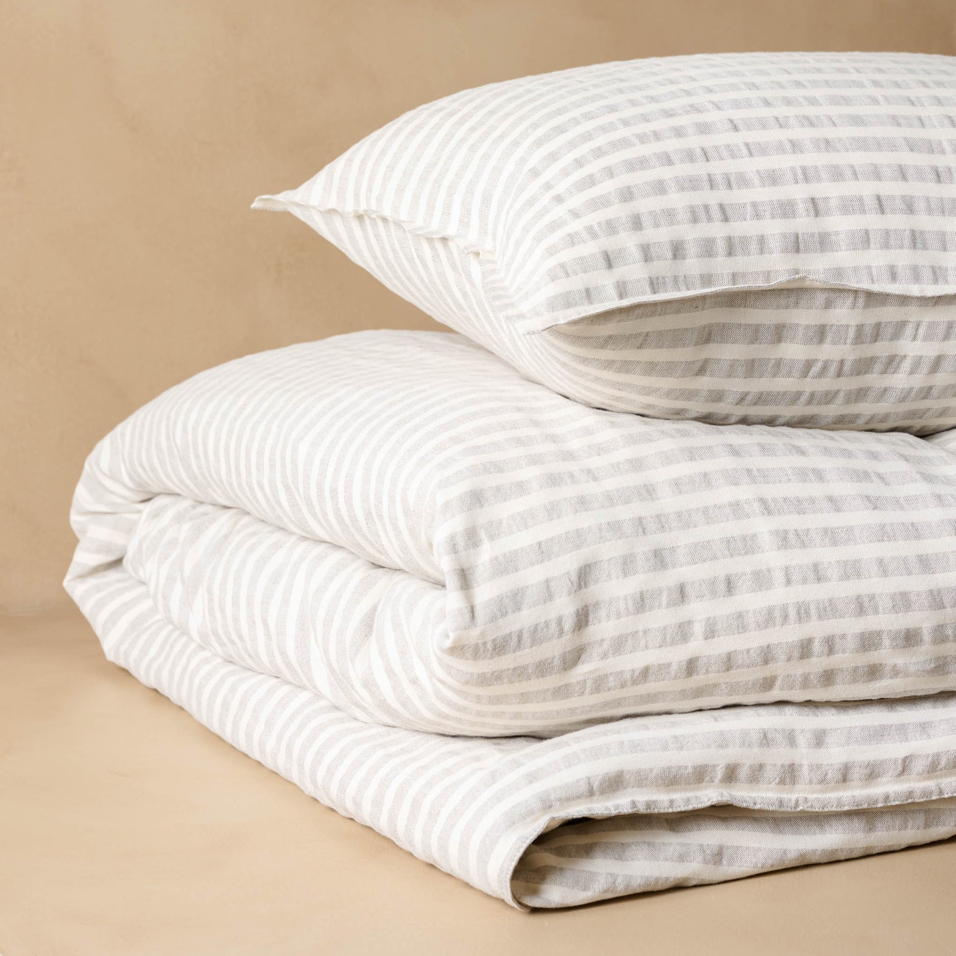 Shadow Grey + Oatmeal Stripe Linen Cotton Duvet with matching sham angled
