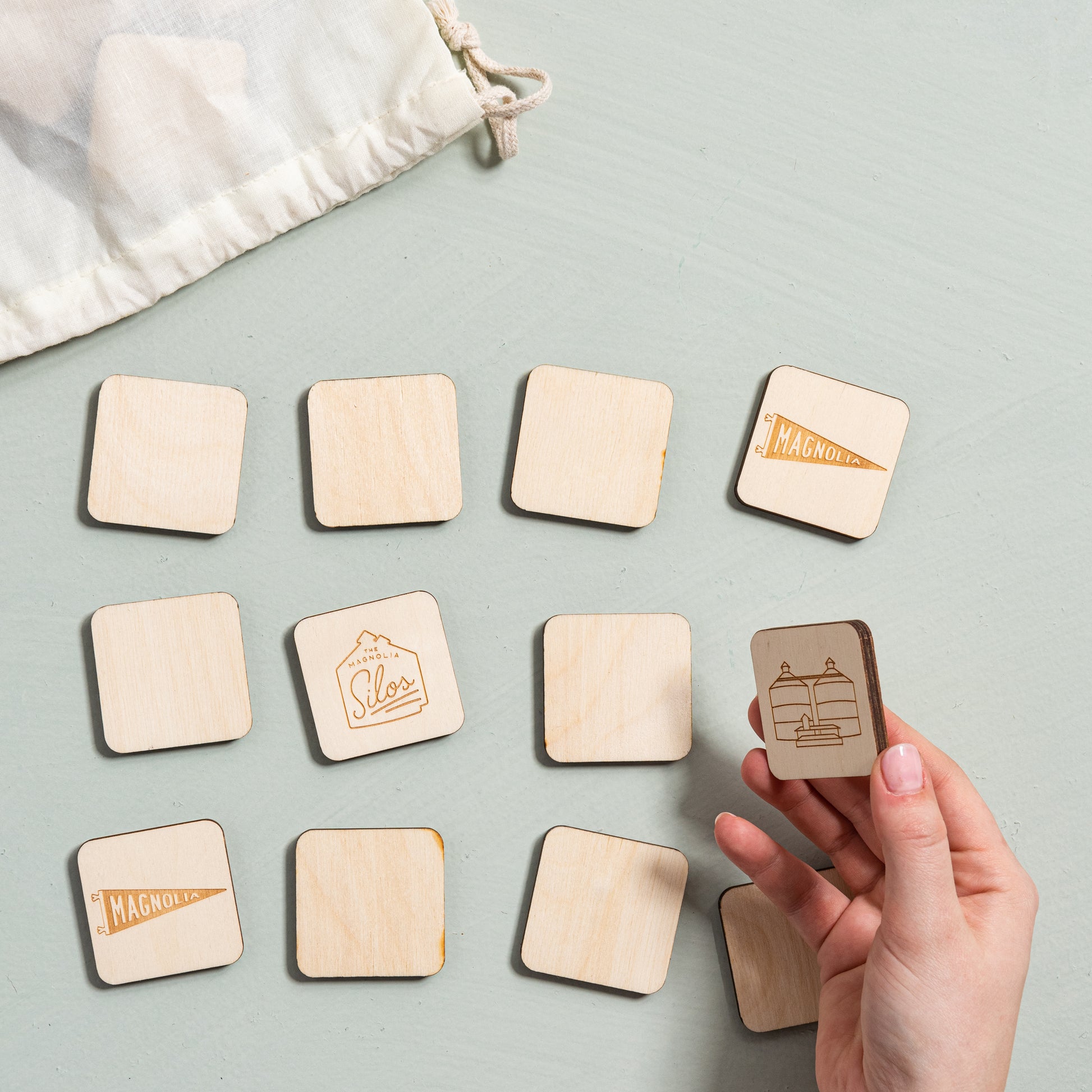 magnolia matching game including twelve pairs wooden tiles