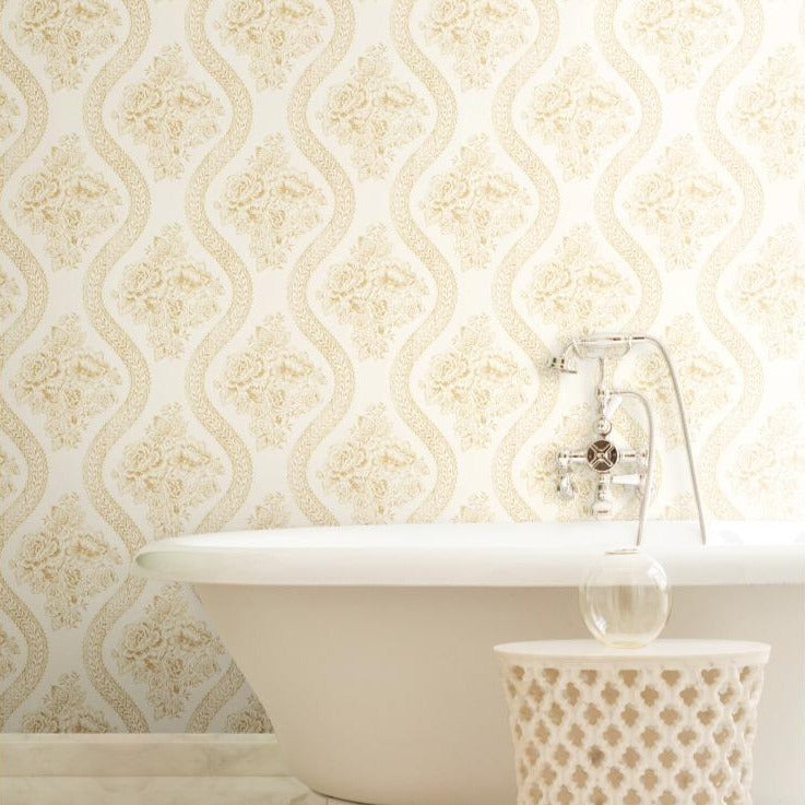 golden-yellow floral pattern on white wallpaper