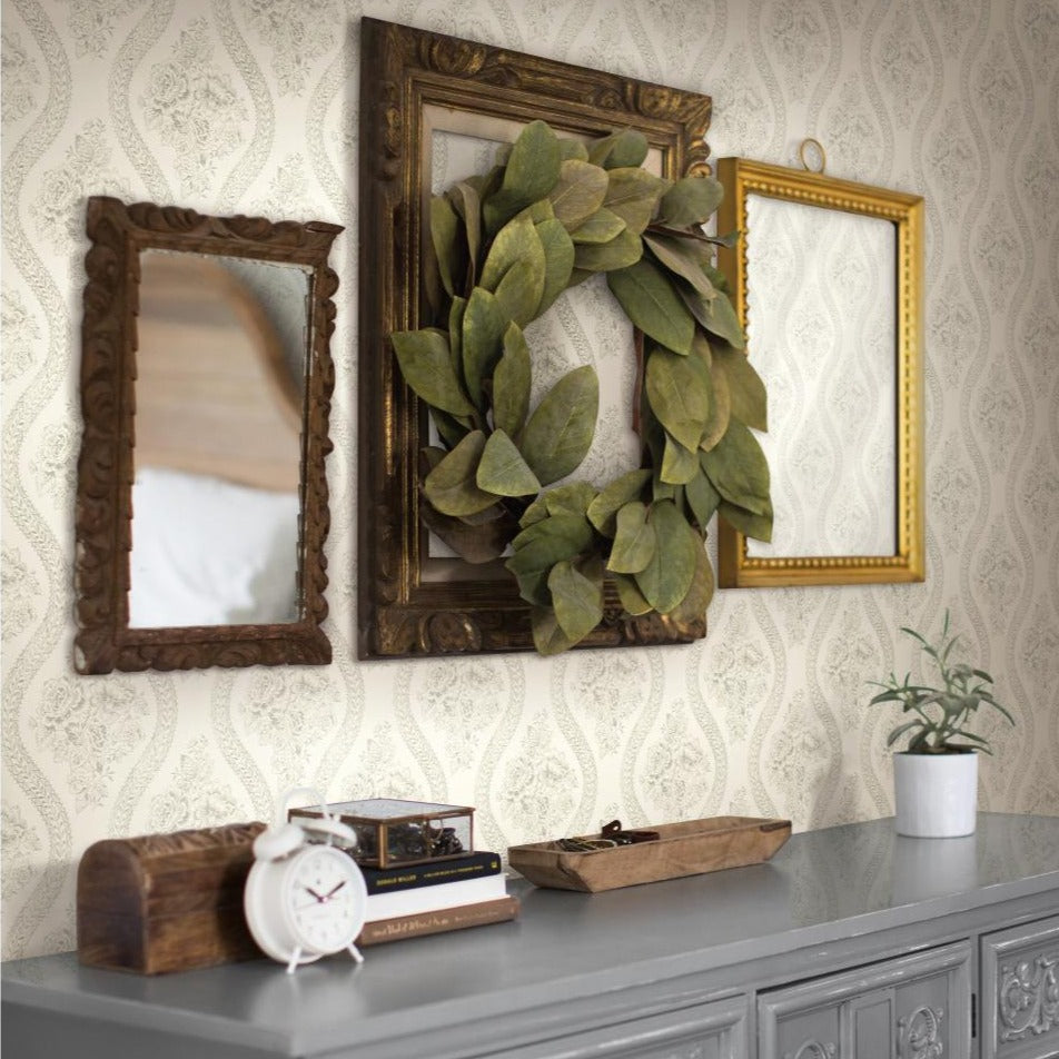 light grey floral pattern on white wallpaper