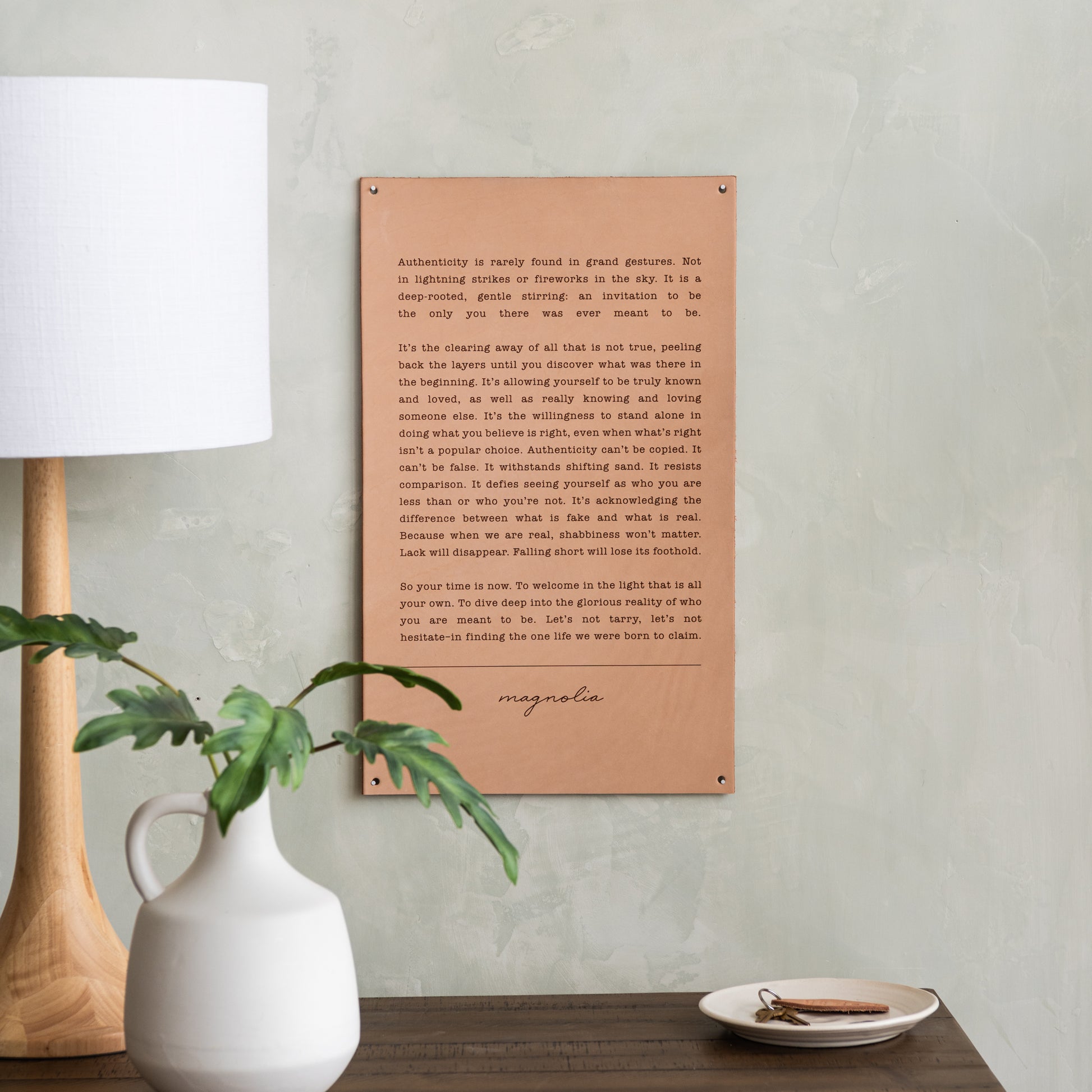 light leather sign with excerpt from magnolia spring 2019 journal about authenticity