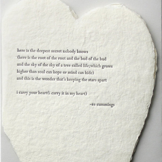 deckled paper heart with quote from ee cummings embossed