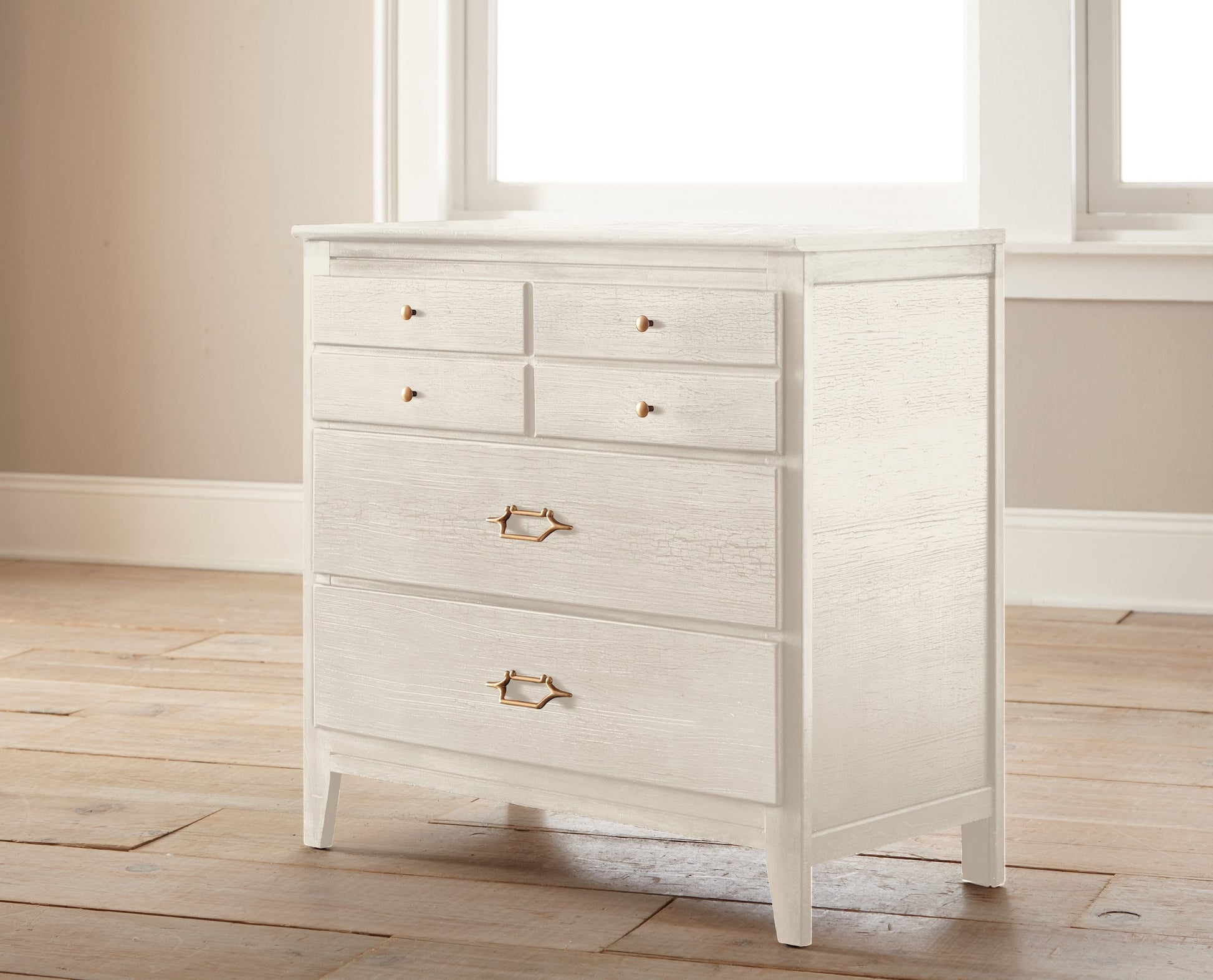 An ivory shade dusted with pink and yellow chalk style paint