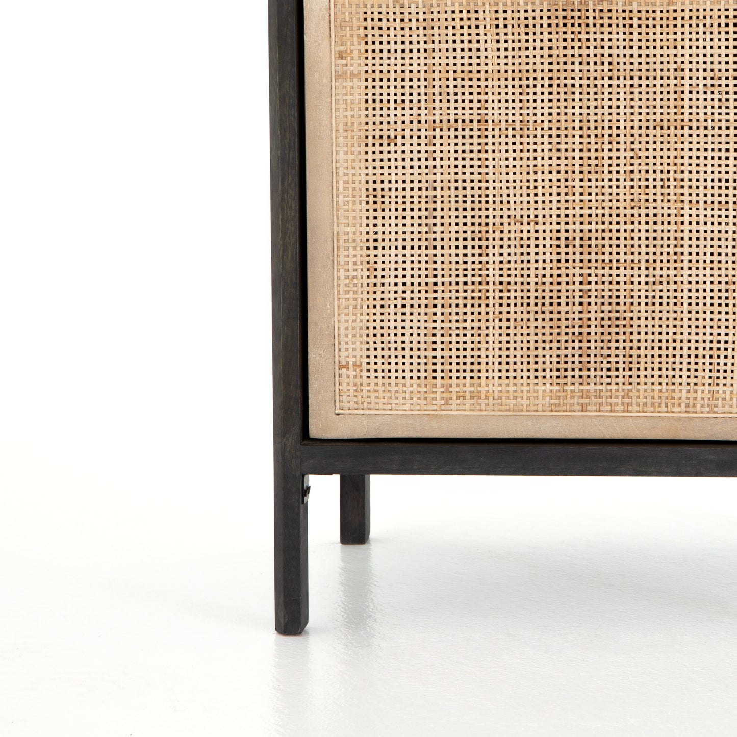 modern black stained wooden nightstand with natural cane front cabinet door
