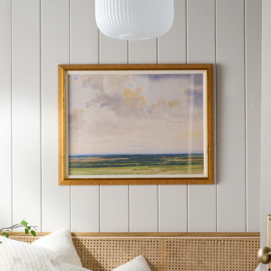 framed wall art called Vista View on a wall above a bench in an entryway