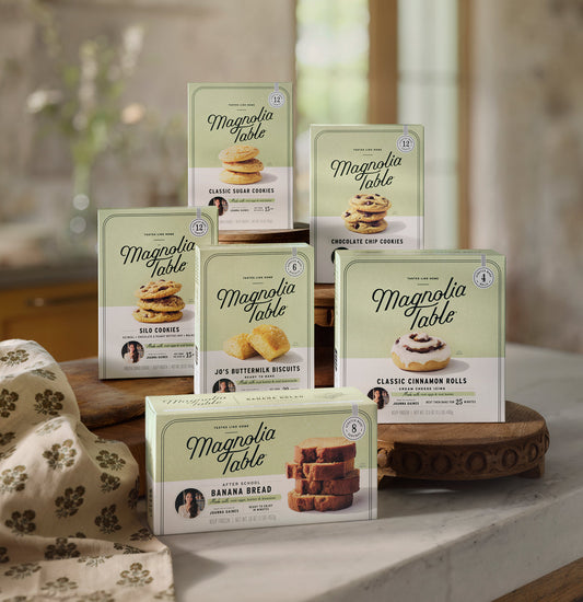 boxes of all six Magnolia Table frozen baked goods on a kitchen countertop