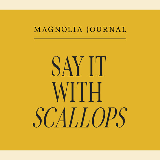 Yellow graphic with dark text that reads "say it with scallops."