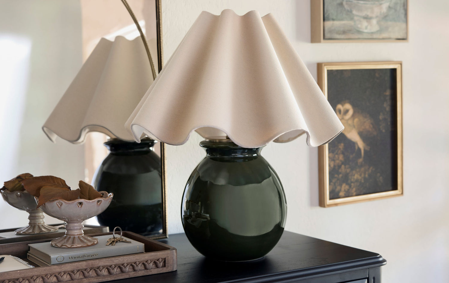 Shop table lamps. Image features a green ceramic base lamp with a white scalloped shade.