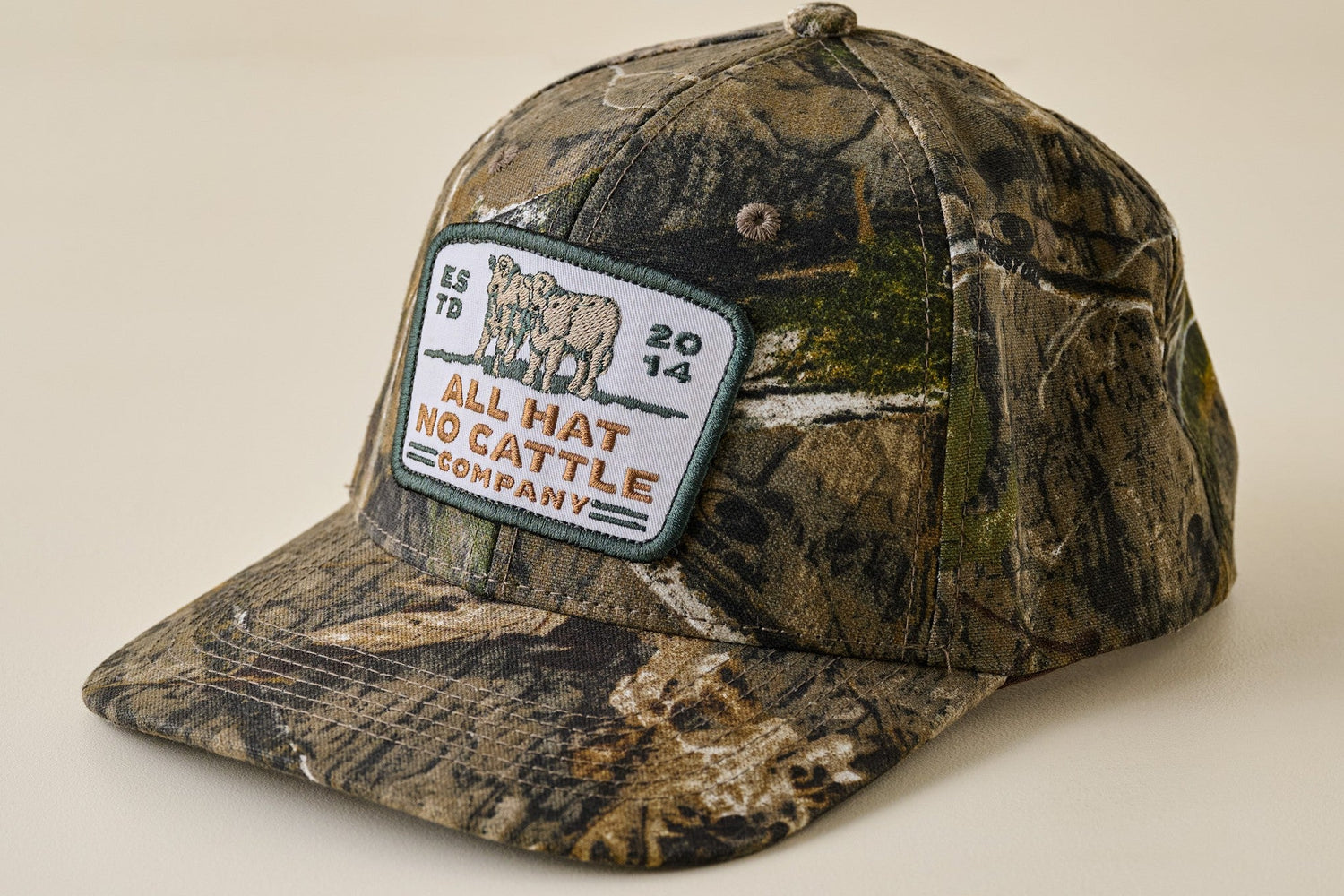Shop gifts for him. Image features a camo printed baseball hat with a patch that reads all hat no cattle.