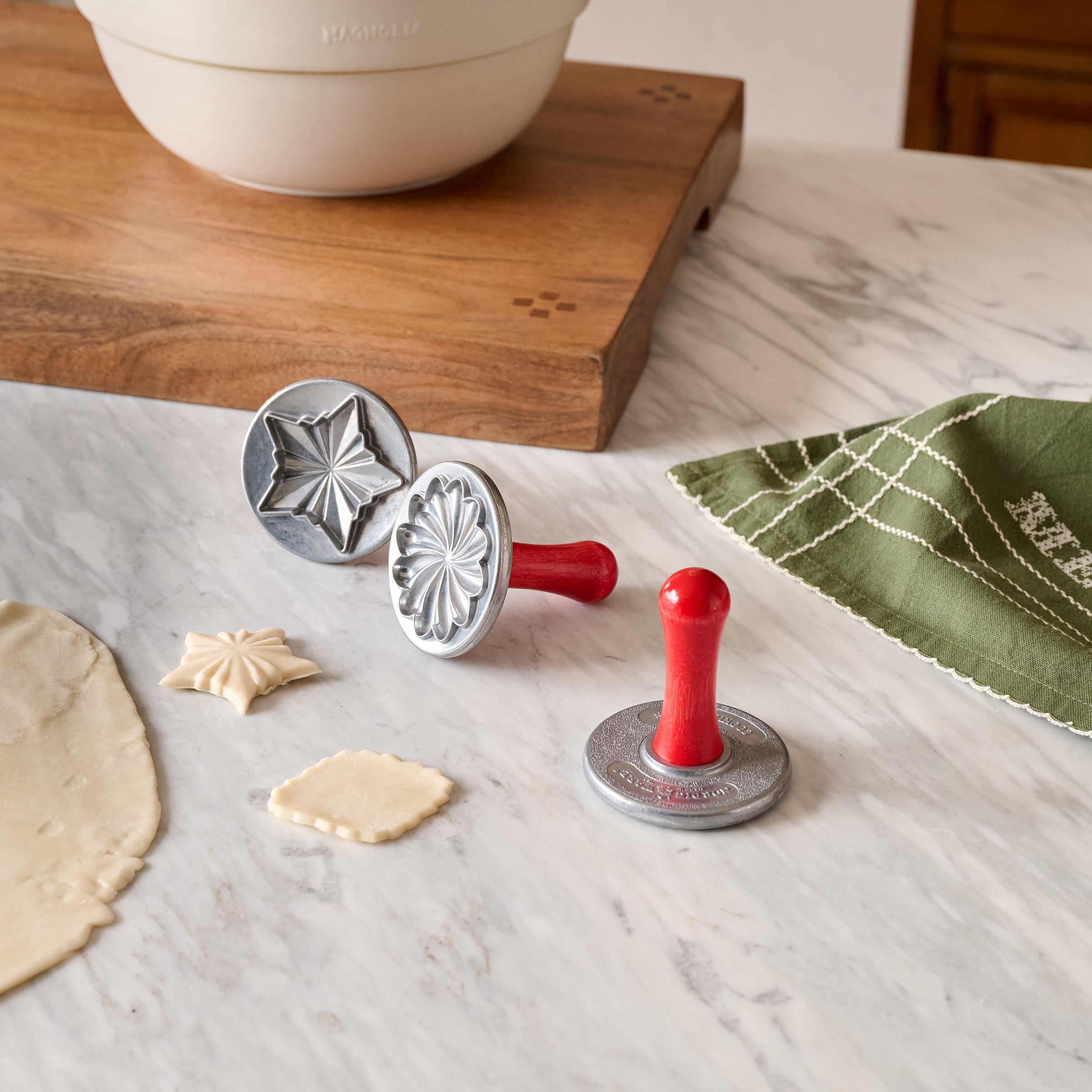 Pretty Pleated Cookie Stamps shown on kitchen counter with cookie dough
