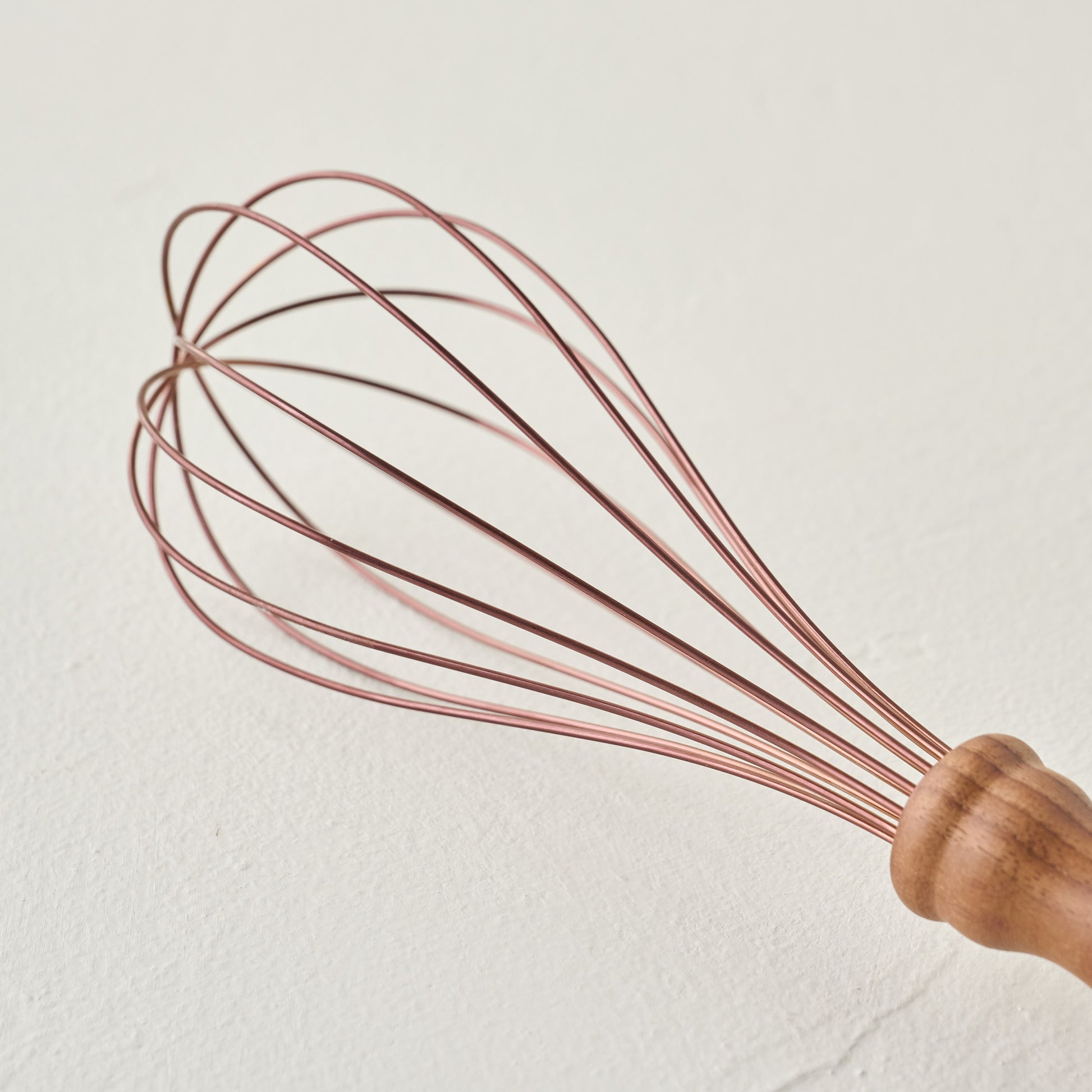 Copper and Walnut Whisk up close