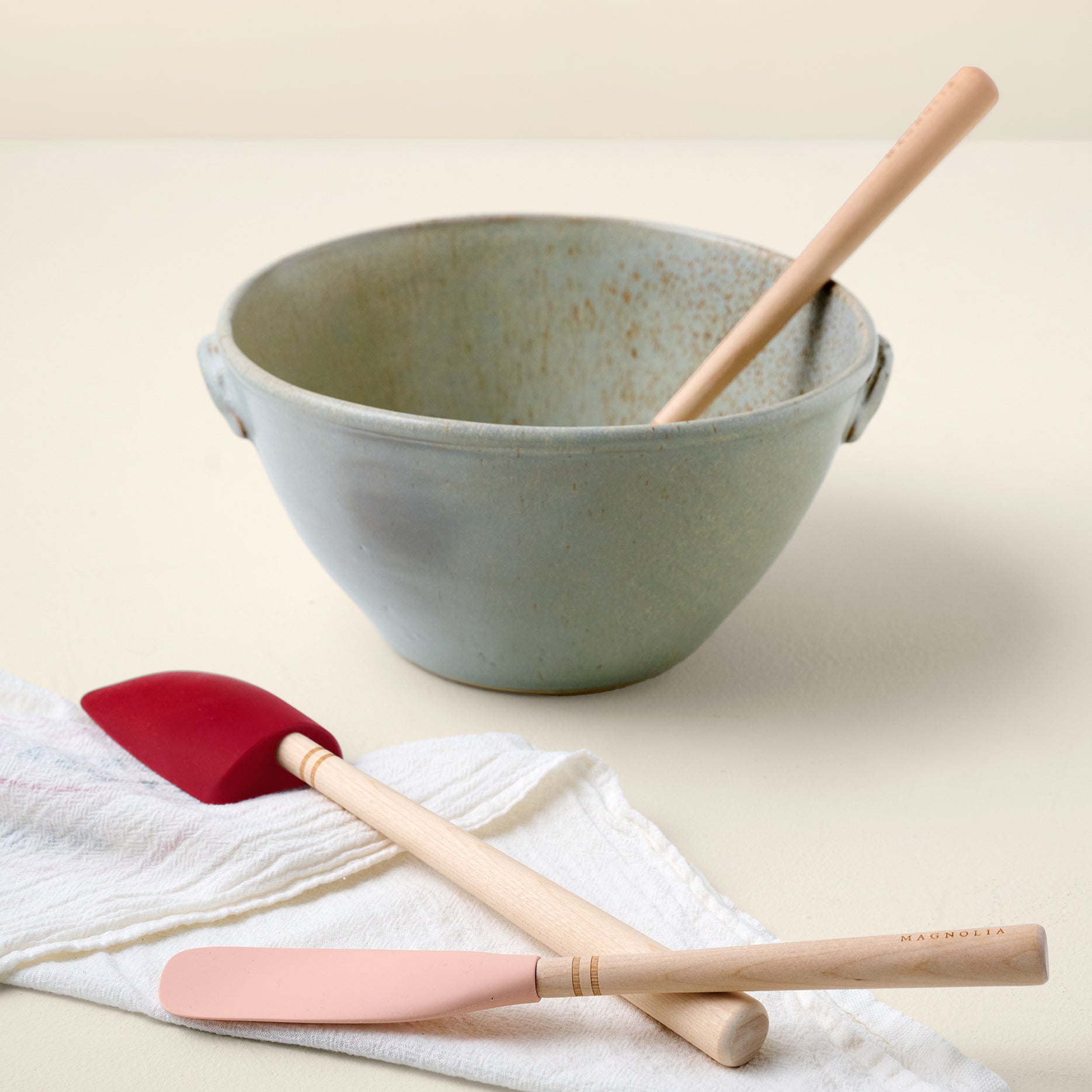 Laurie Spatula Bundle shown with mixing bowl and tea towel