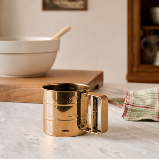 Copper Flour Sifter shown on kitchen counter