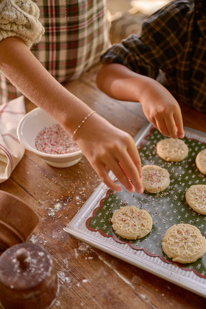 Reversible Holiday Baking Mat on baking sheet with cookies