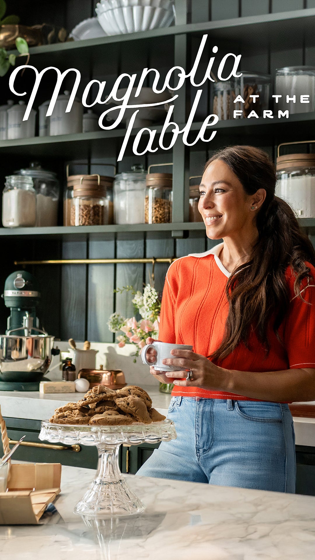 Joanna Gaines holding a cup in her butler's pantry.  Magnolia Table at the Farm.