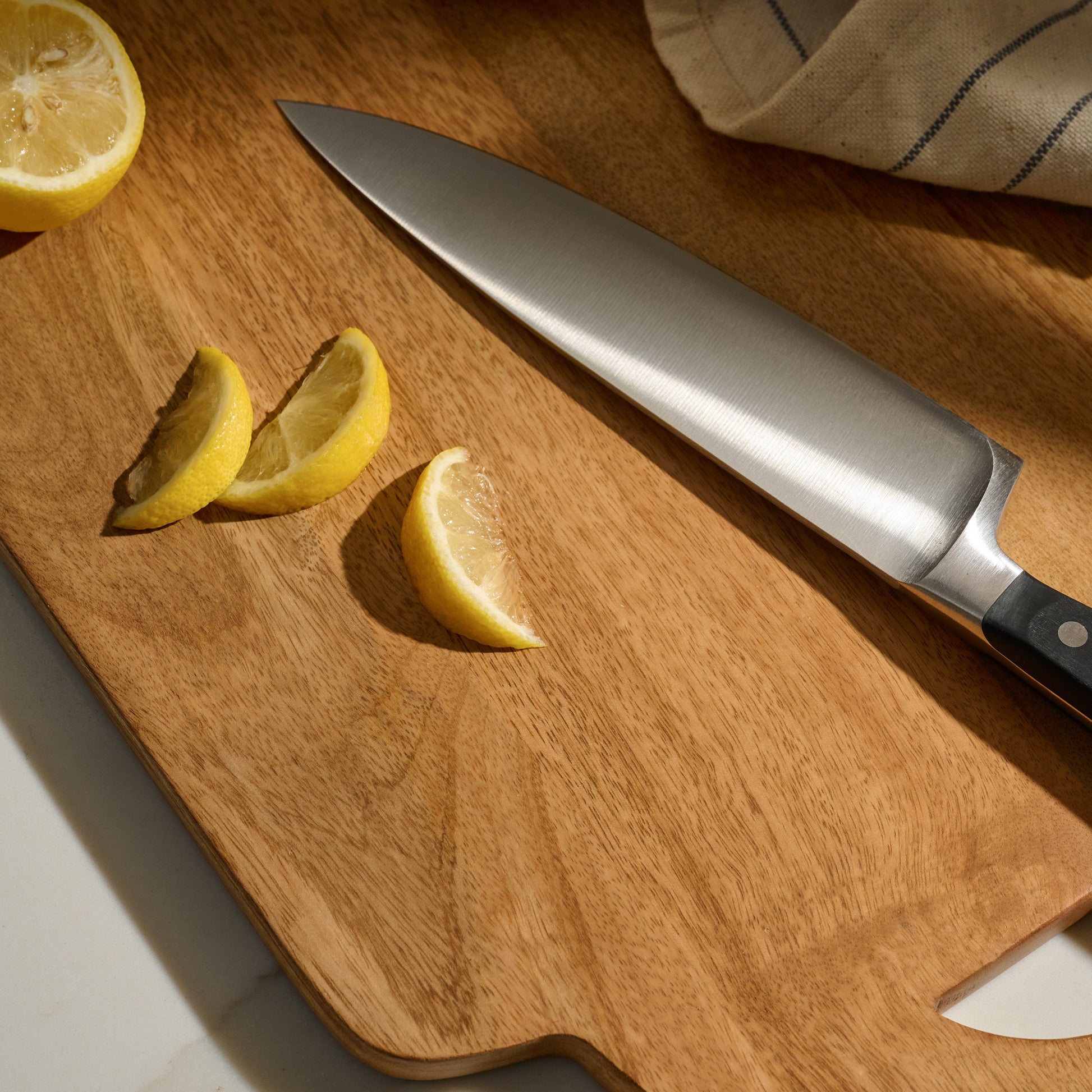 Wusthof Classic 6pc Knife Block Set one knife with lemons on a cutting board