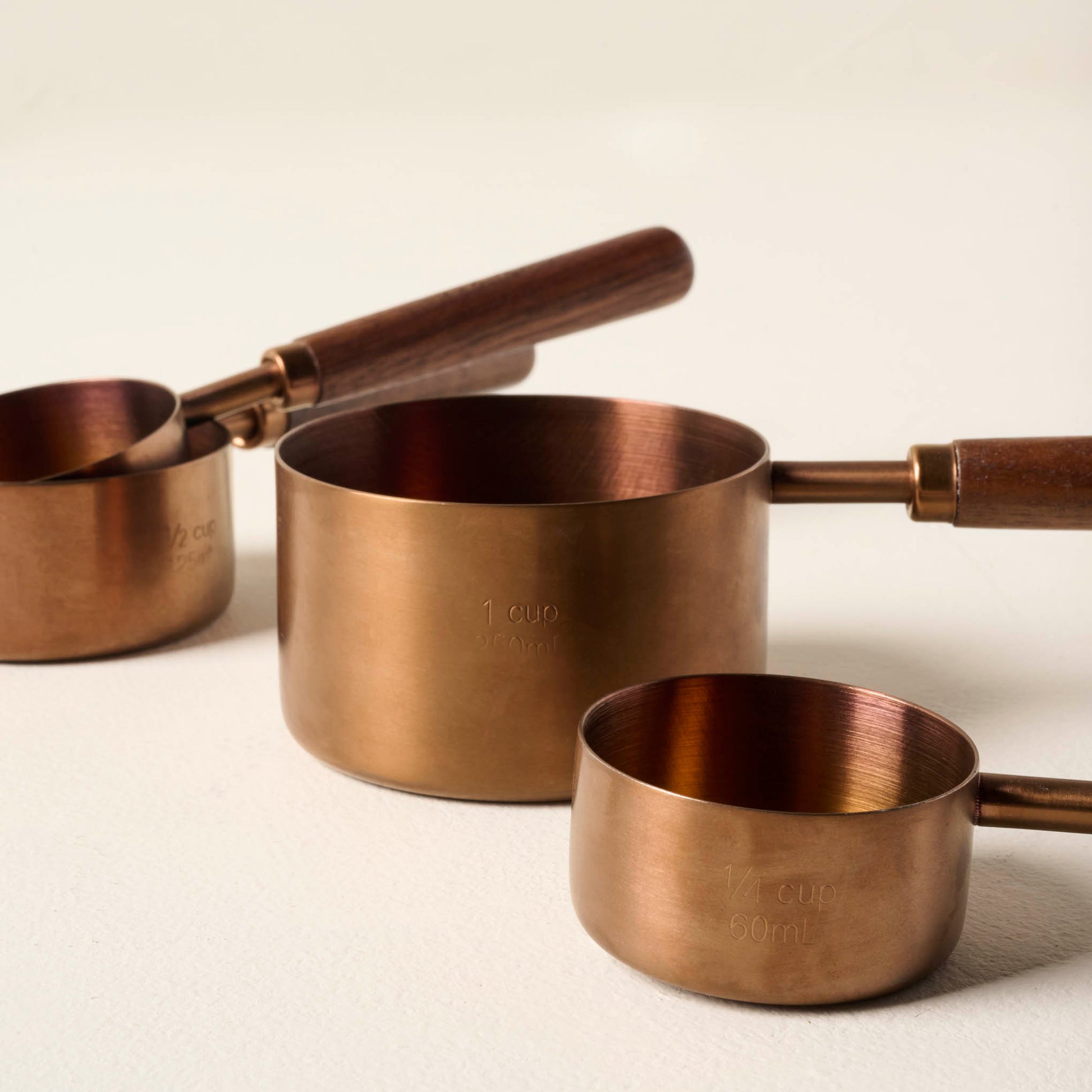 Walnut and Copper Measuring Cups