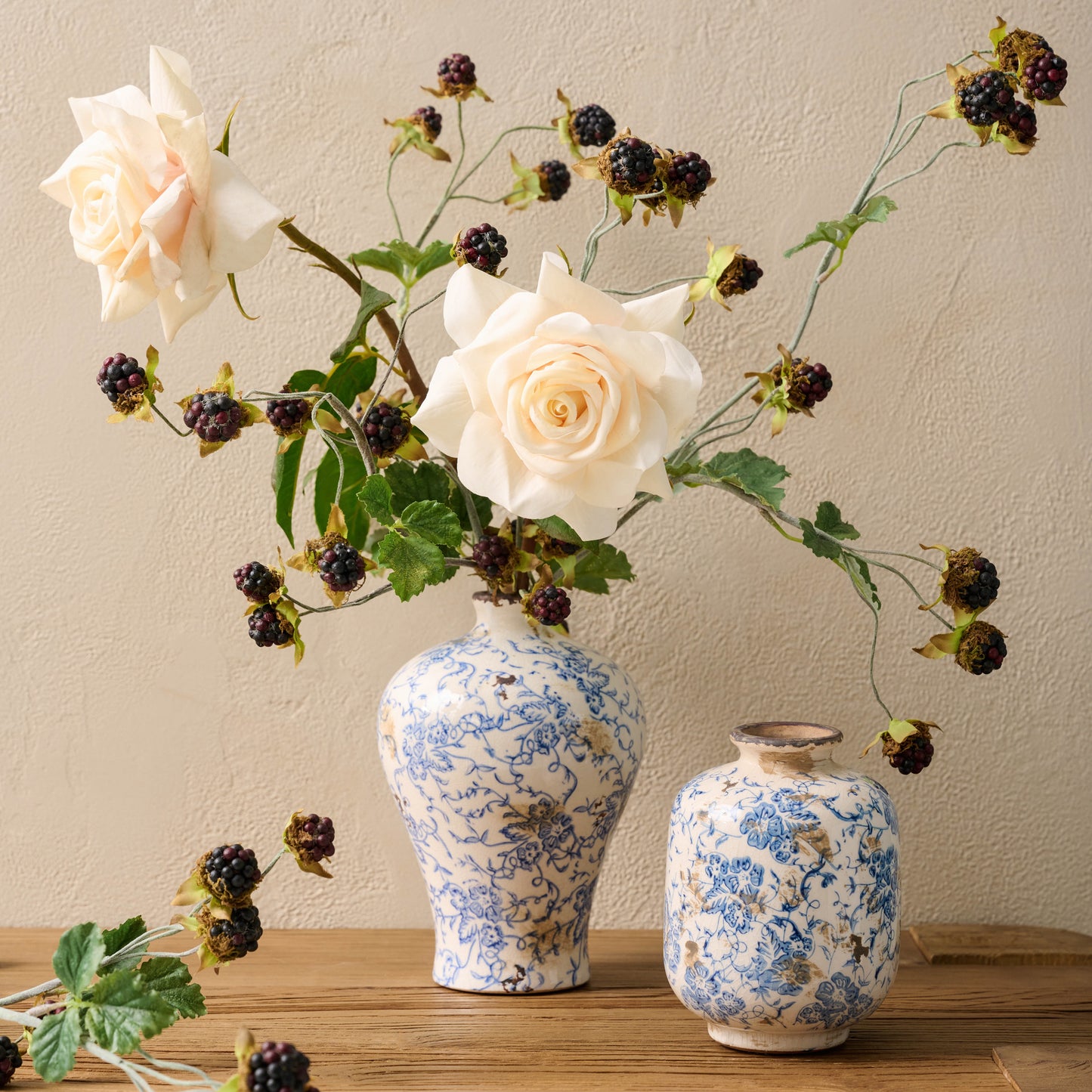 Blue and White Distressed Vase containing blackberry bush spray