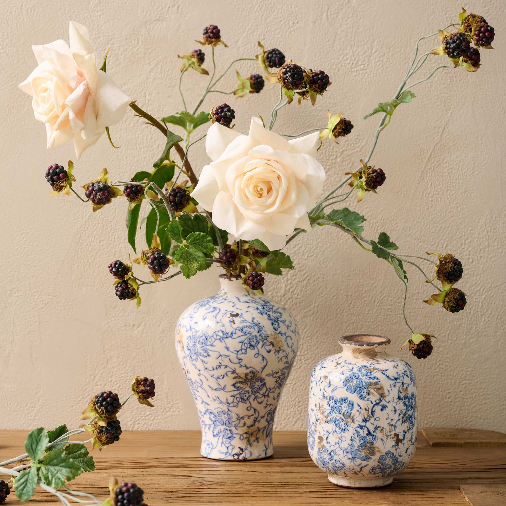 Blue and White Distressed Vase containing blackberry bush spray