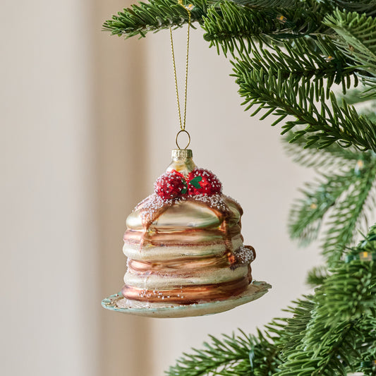 Frosted Pancakes Ornament shown hung from tree