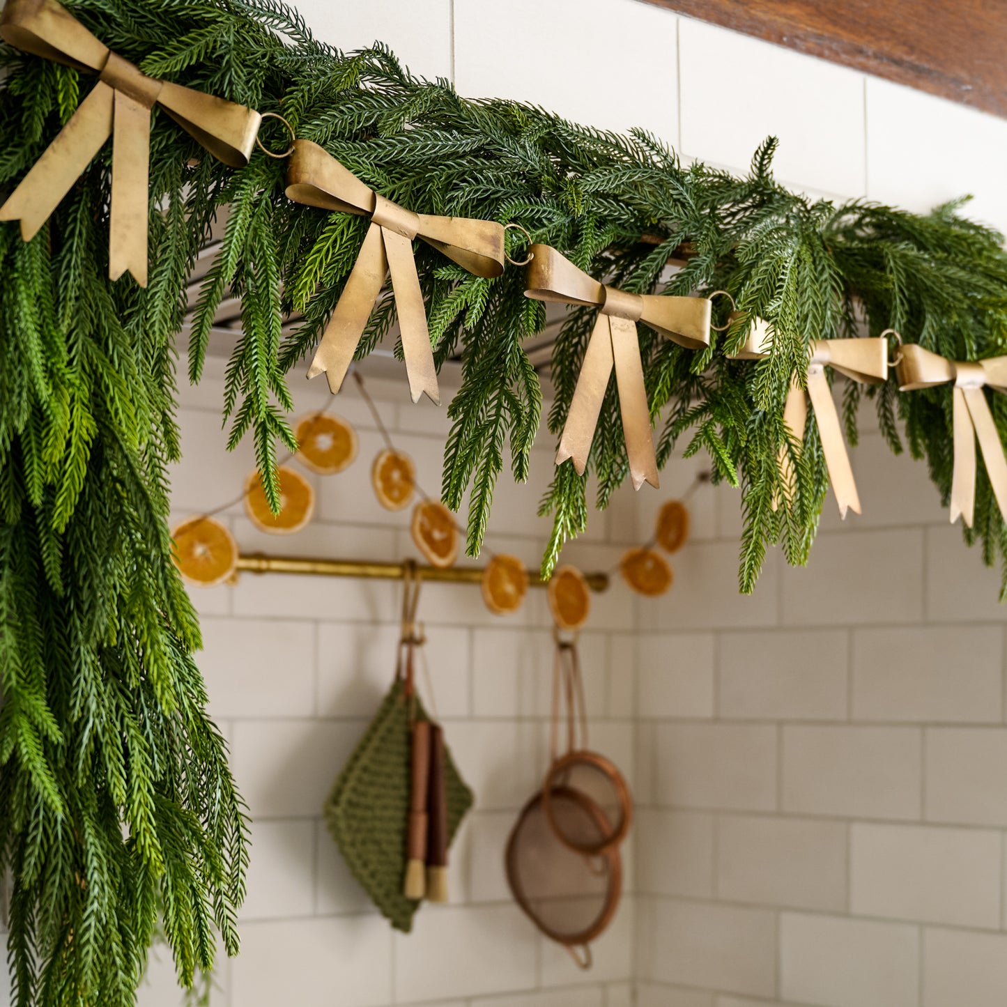 Gloria Brass Bow Garland layered