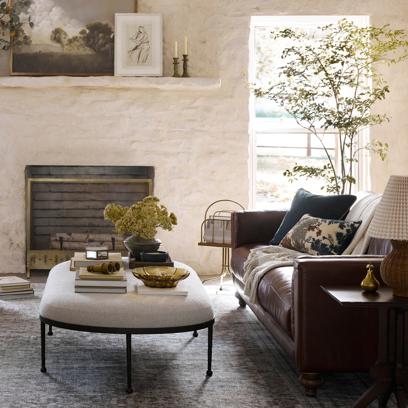 Cozy living room with a fireplace, sofa, and decorative items.