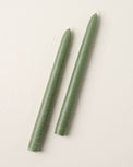 two colonial green taper candles