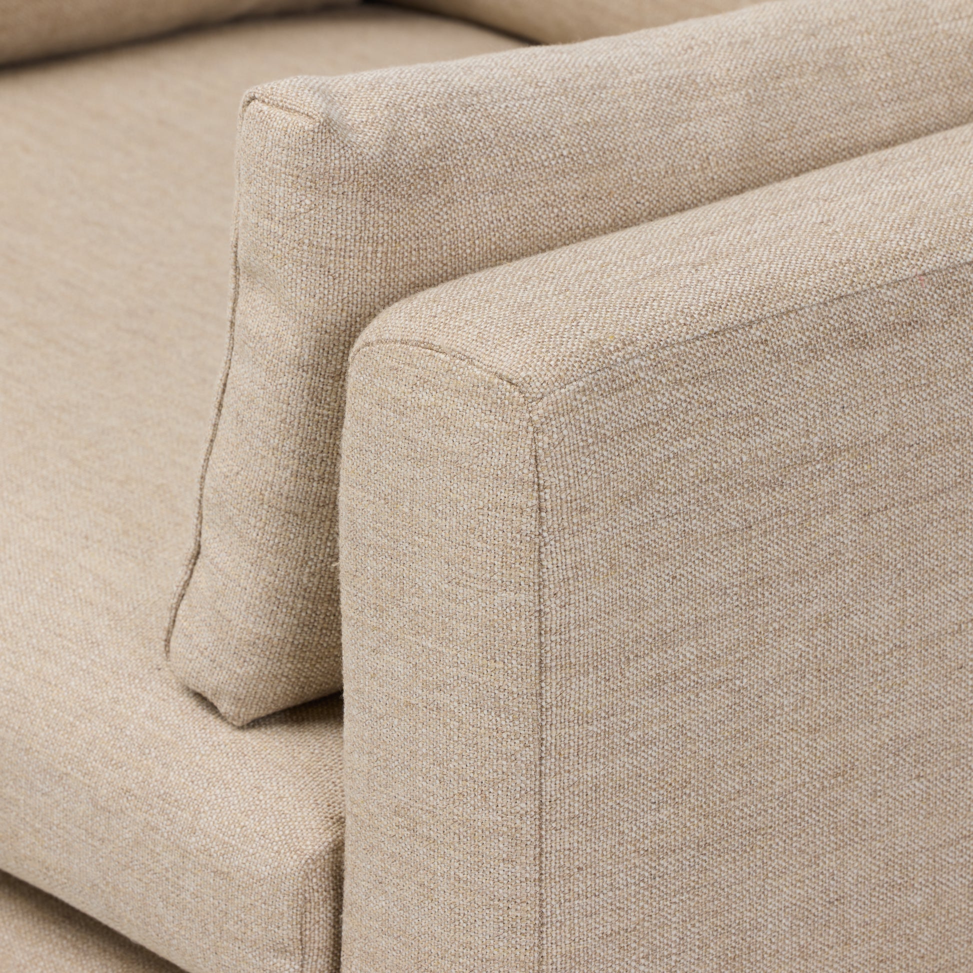 Alcala Wheat close up view of armrest with cushion