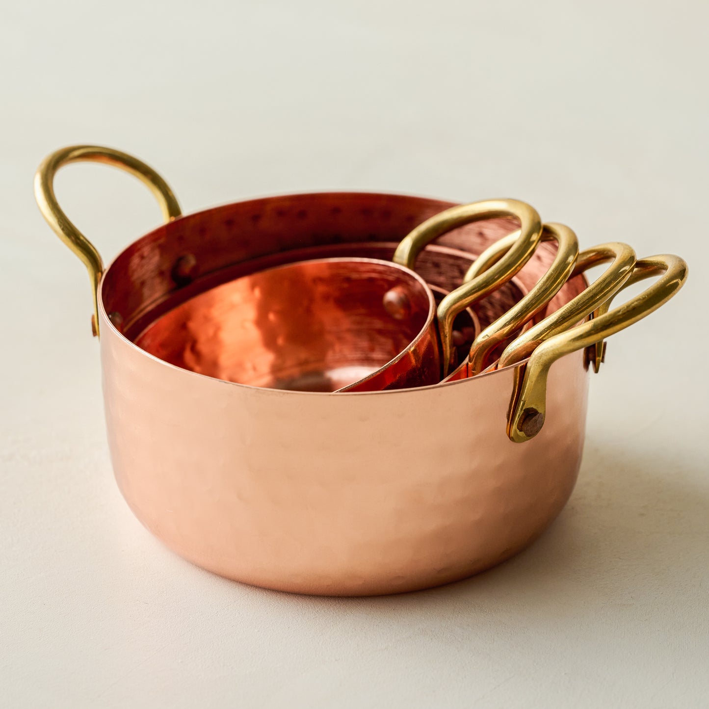 Hammered Copper & Gold Measuring Cups stacked