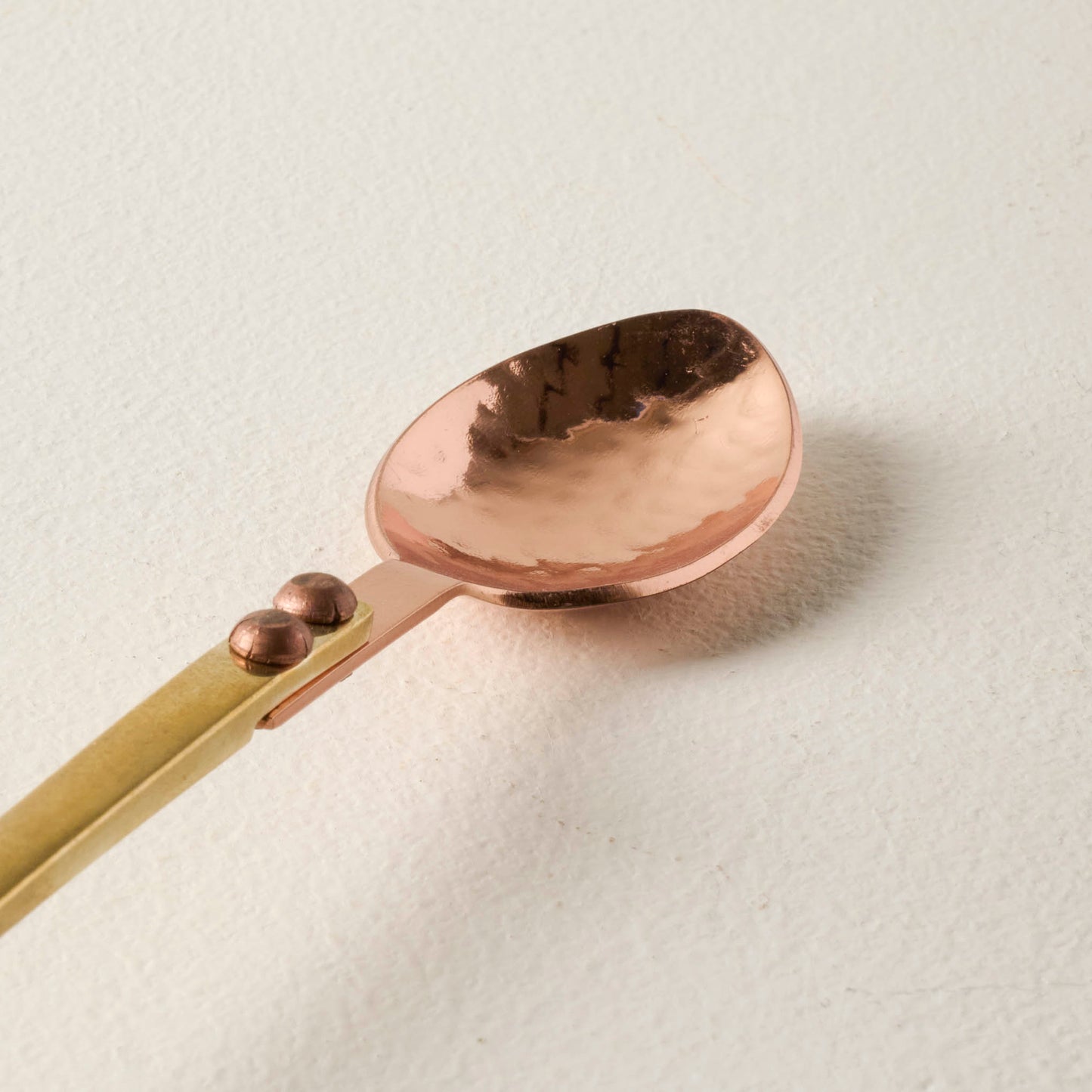 Hammered Copper and Gold Stirring Spoon up close