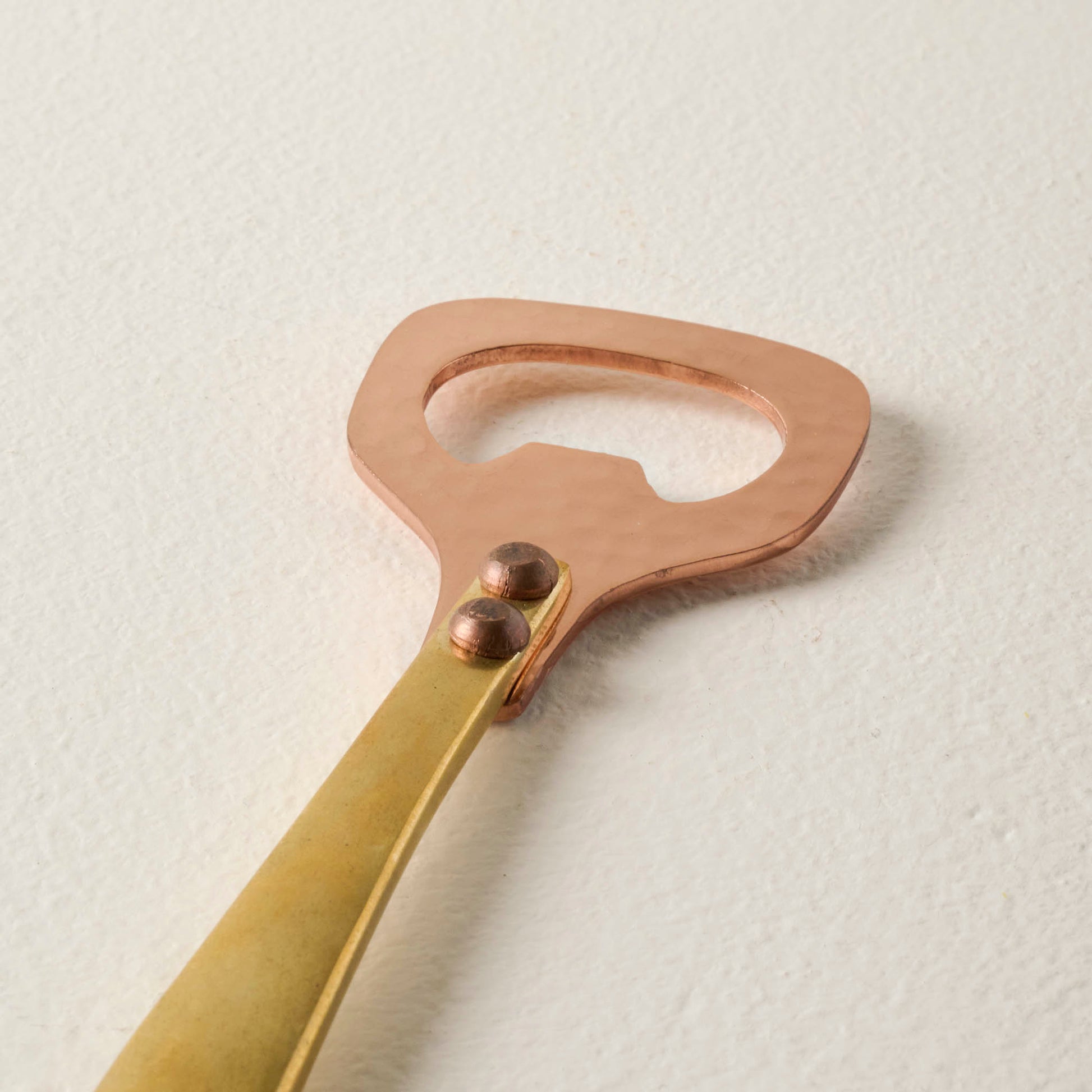 Hammered Copper and Gold Bottle Opener up close