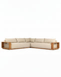 Sectional sofa with wooden frame and beige cushions on a white background